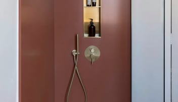 A shower remodel featuring natural stone surfaces