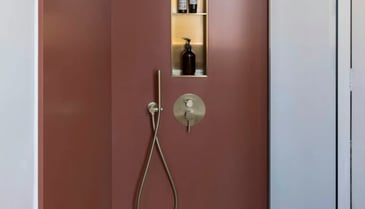 A shower remodel featuring natural stone surfaces